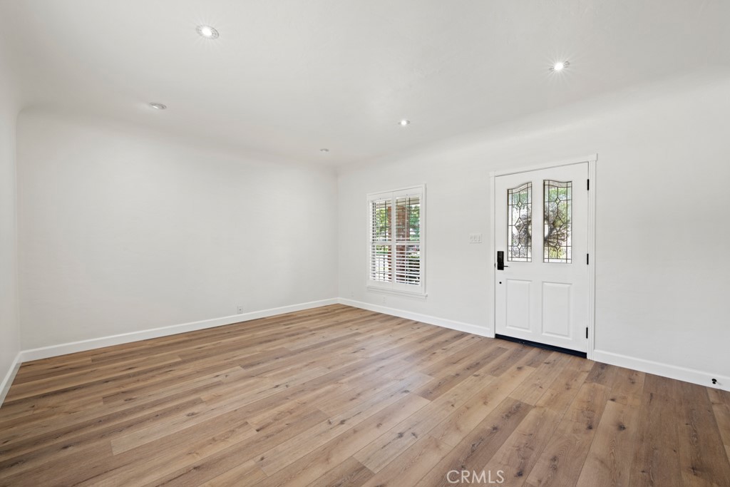 731 North Beachwood Drive Burbank, CA 91506 - Photo 13 of 53 wooden floor in an empty room with a window