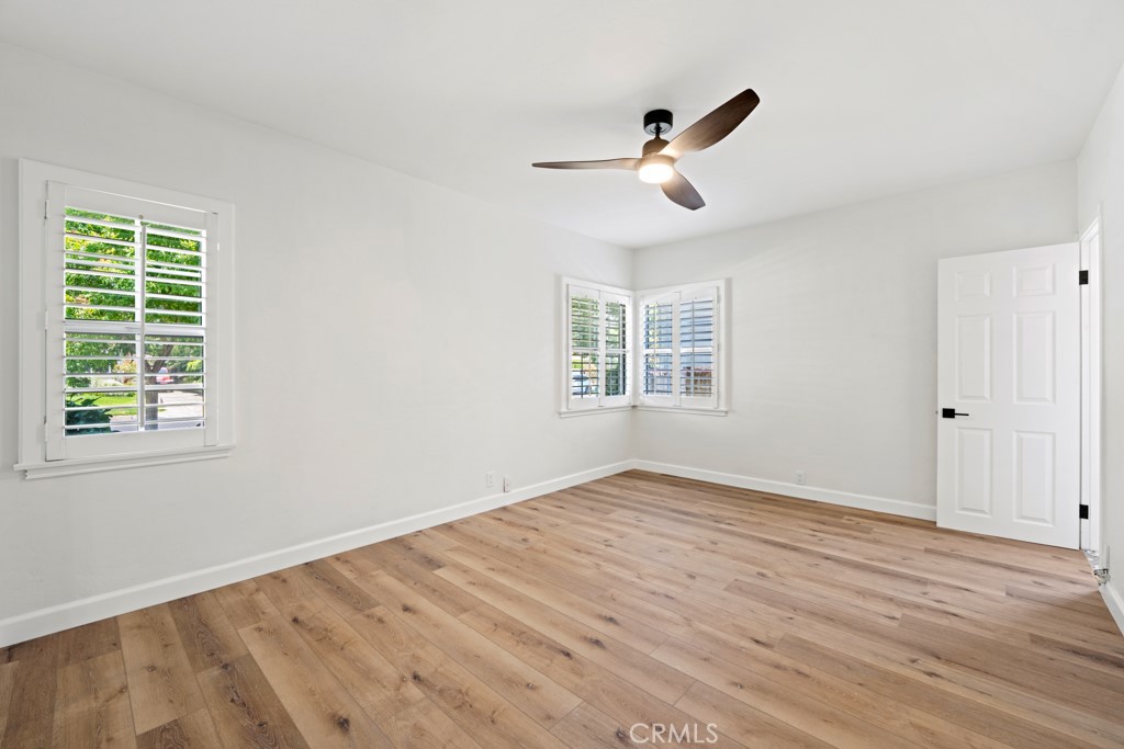 731 North Beachwood Drive Burbank, CA 91506 - Photo 17 of 53 a view of an empty room with wooden floor and a window