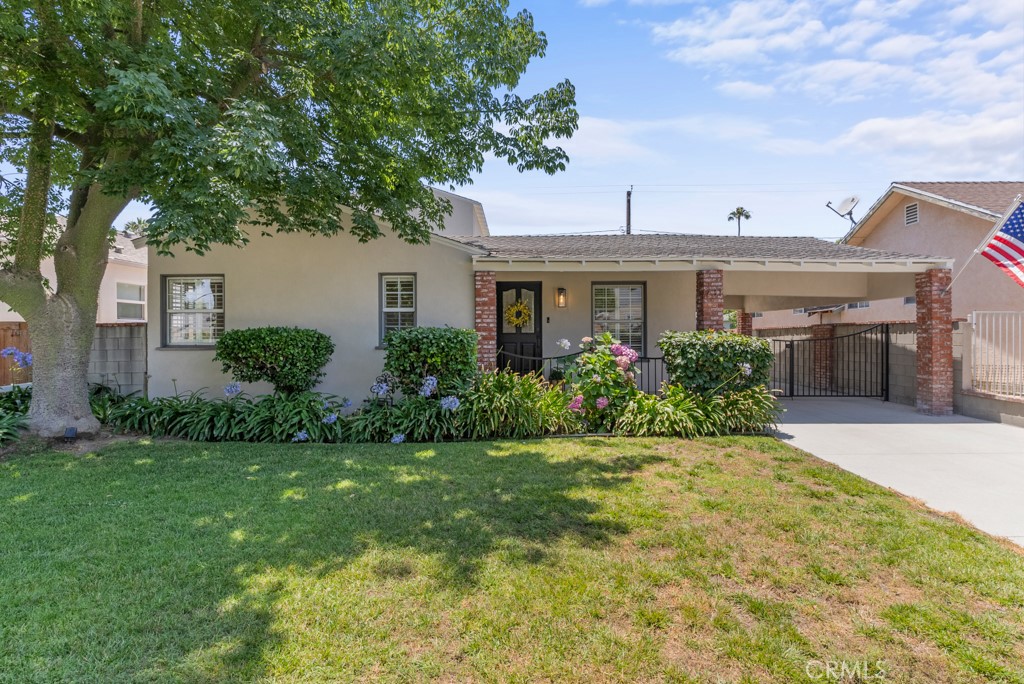 731 North Beachwood Drive Burbank, CA 91506 - Photo 2 of 53 a front view of a house with a garden