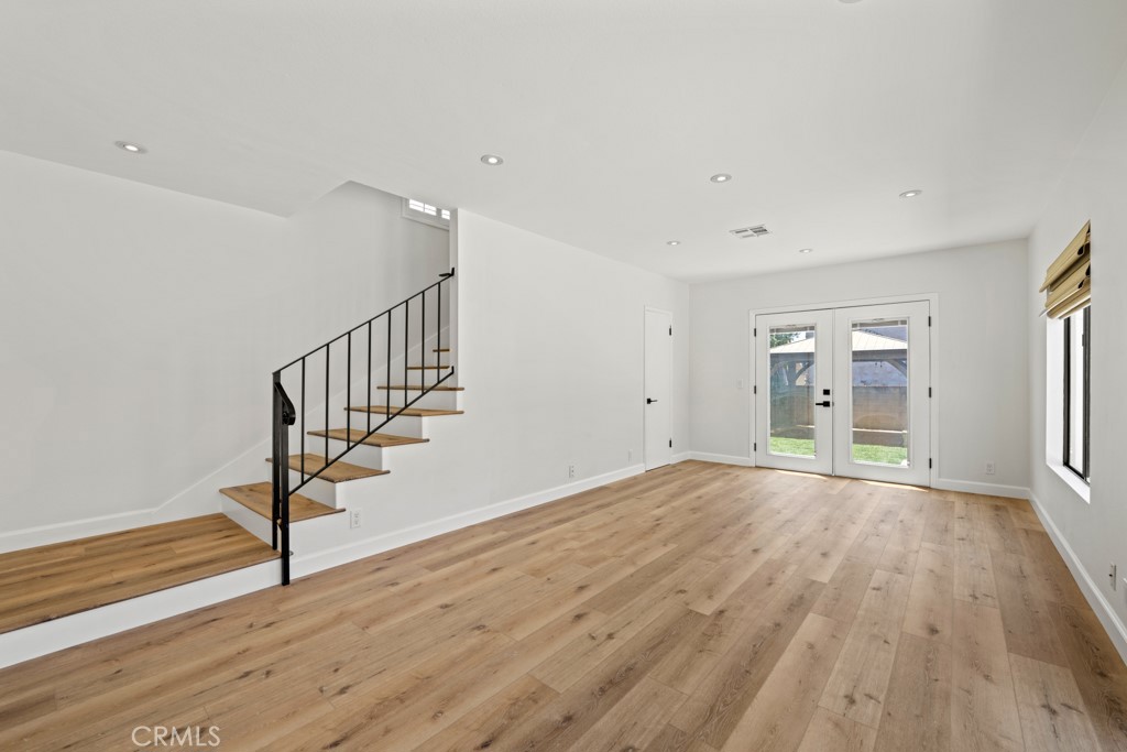 731 North Beachwood Drive Burbank, CA 91506 - Photo 30 of 53 a view of an empty room with wooden floor and a window