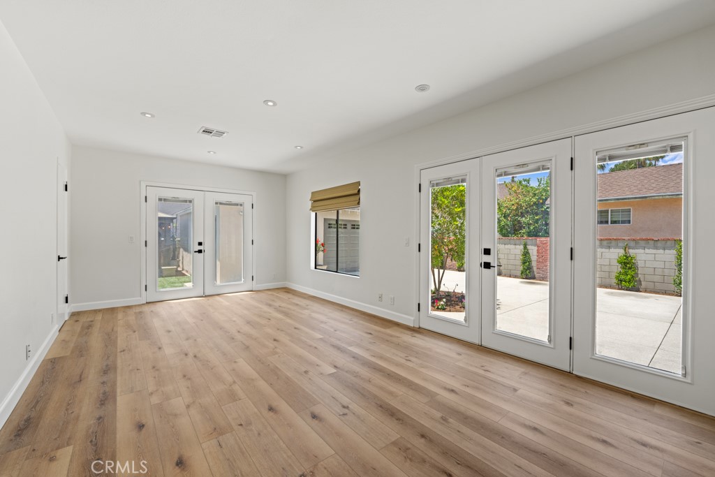 731 North Beachwood Drive Burbank, CA 91506 - Photo 32 of 53 a view of an empty room with wooden floor and a window