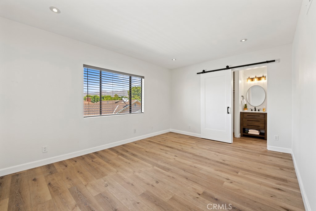 731 North Beachwood Drive Burbank, CA 91506 - Photo 33 of 53 an empty room with windows and closet