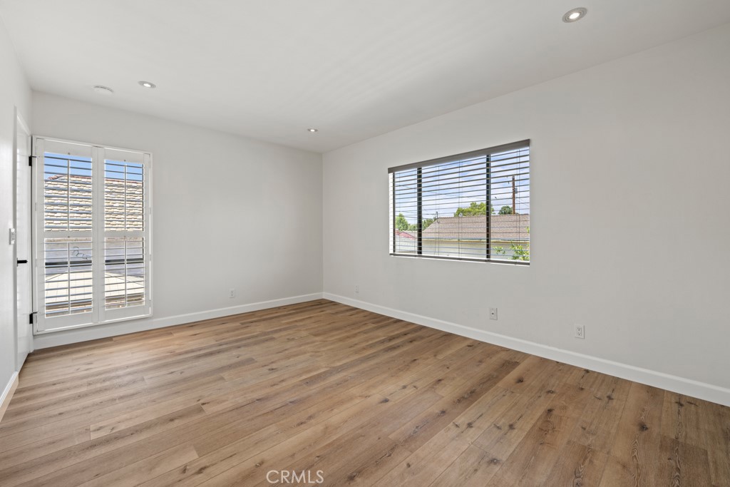 731 North Beachwood Drive Burbank, CA 91506 - Photo 35 of 53 a view of an empty room with wooden floor and a window