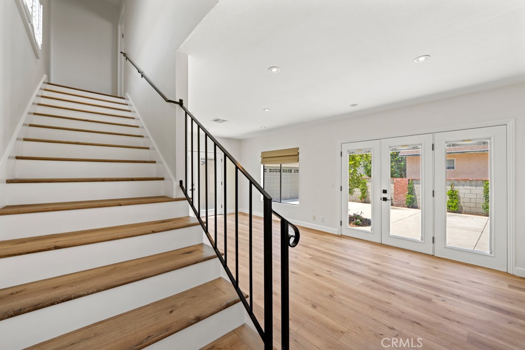 731 North Beachwood Drive Burbank, CA 91506 - Photo 43 of 53 a view of a hallway with wooden floor and staircase