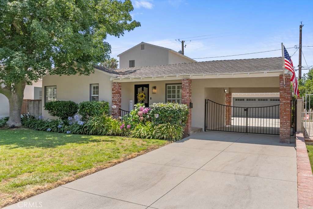 731 North Beachwood Drive Burbank, CA 91506 - Photo 45 of 53 a front view of house with yard and green space