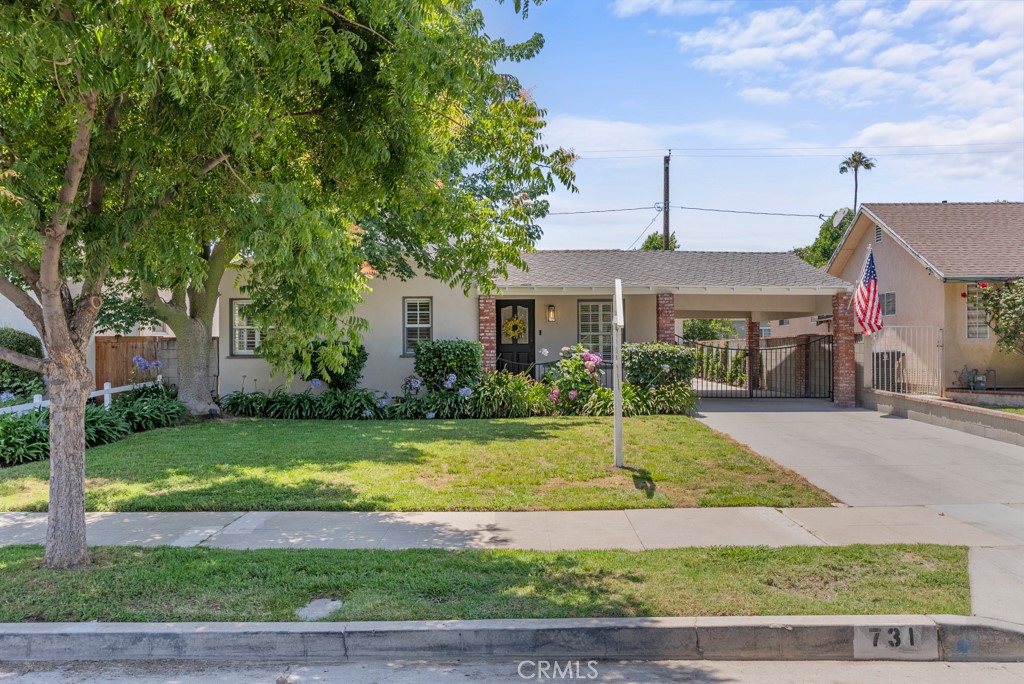 731 North Beachwood Drive Burbank, CA 91506 - Photo 46 of 53 a view of a house with swimming pool and a yard
