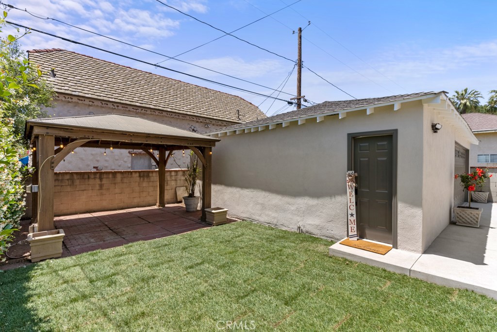 731 North Beachwood Drive Burbank, CA 91506 - Photo 8 of 53 a view of a backyard with a patio and a yard