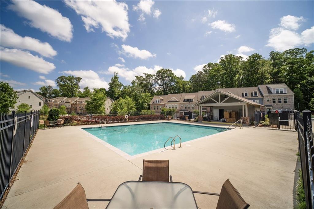 1595 Ridgebrook Downs Mableton, GA 30126 - Photo 39 of 39 a view of a house with swimming pool and sitting area