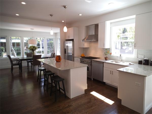 a kitchen with lots of counter top space and dining table