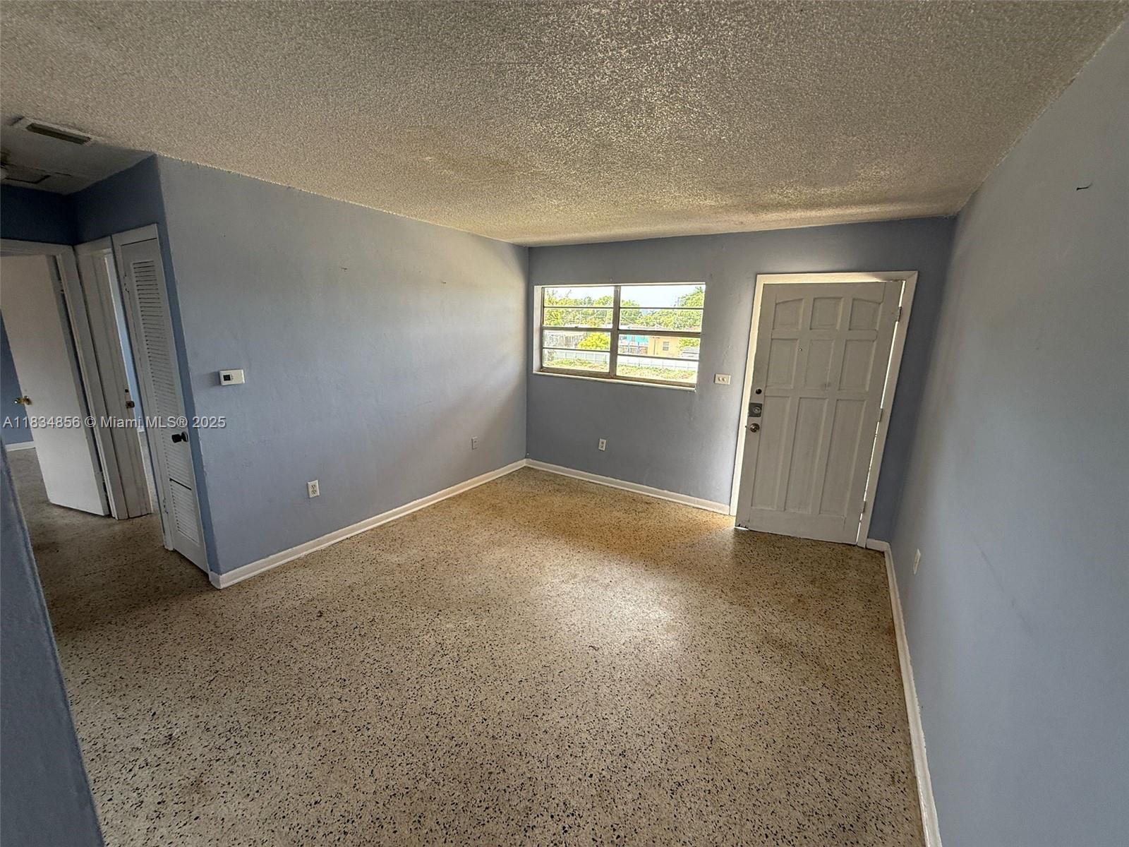 an empty room with windows