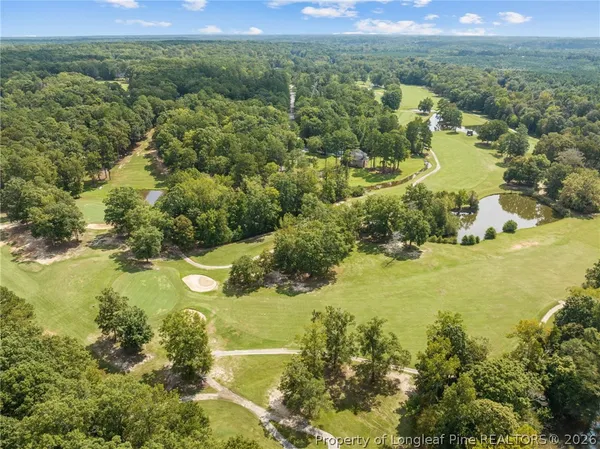 an aerial view of residential house with outdoor space and lake view