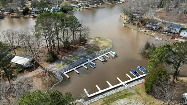an aerial view of a house with a yard