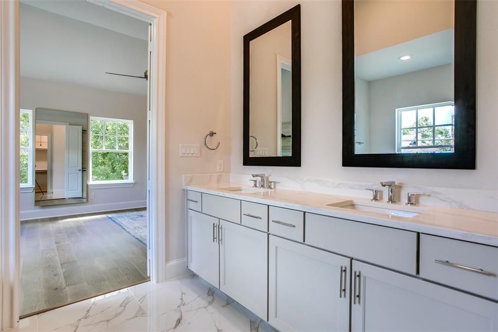 1408 N Avenue Plano, TX 75074 - Photo 15 of 19 Image of community model home.