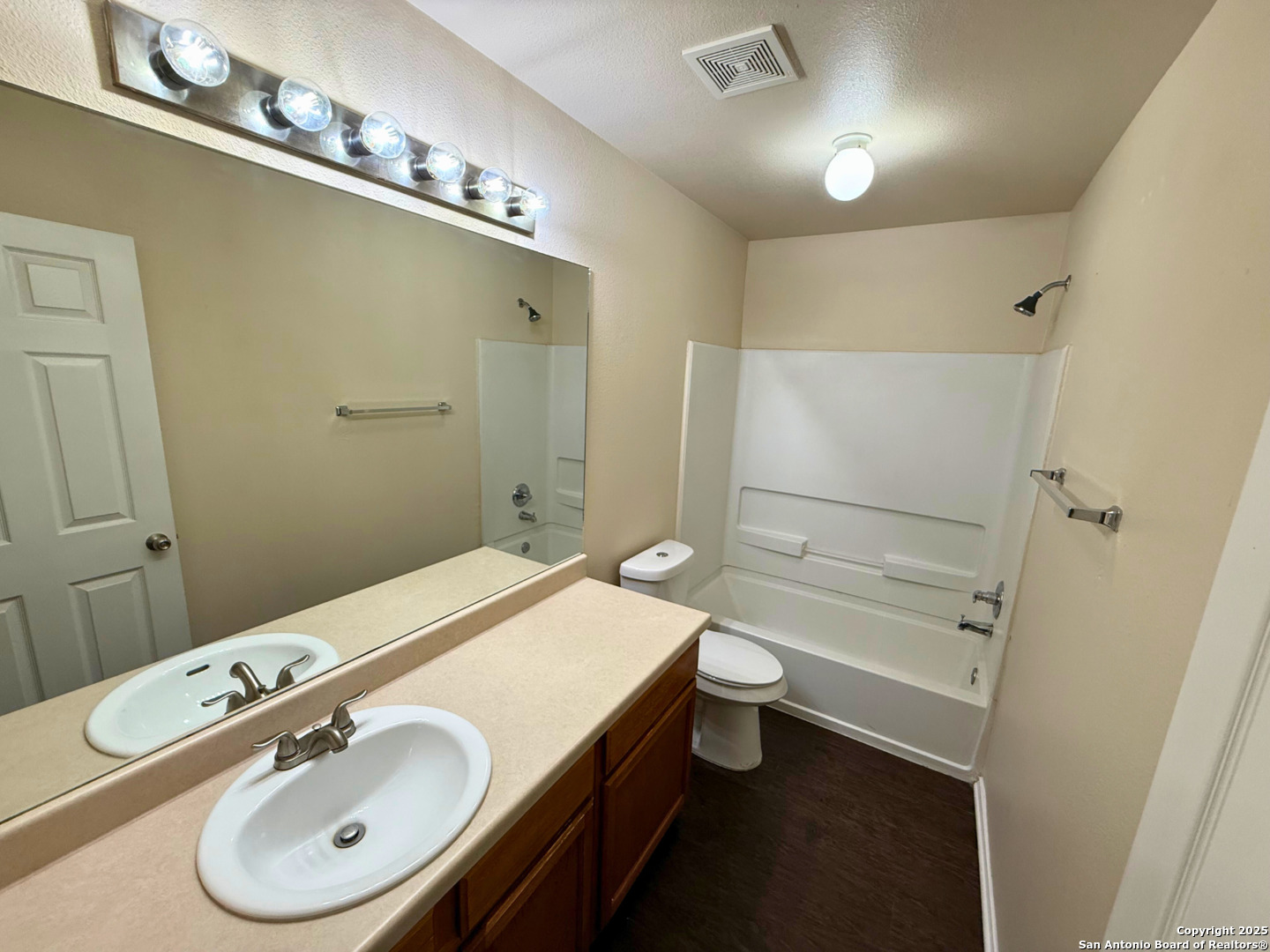 10822 Mathom Landing, Unit 3 Universal City, TX 78148 - Photo 13 of 14 a bathroom with a sink a toilet and shower