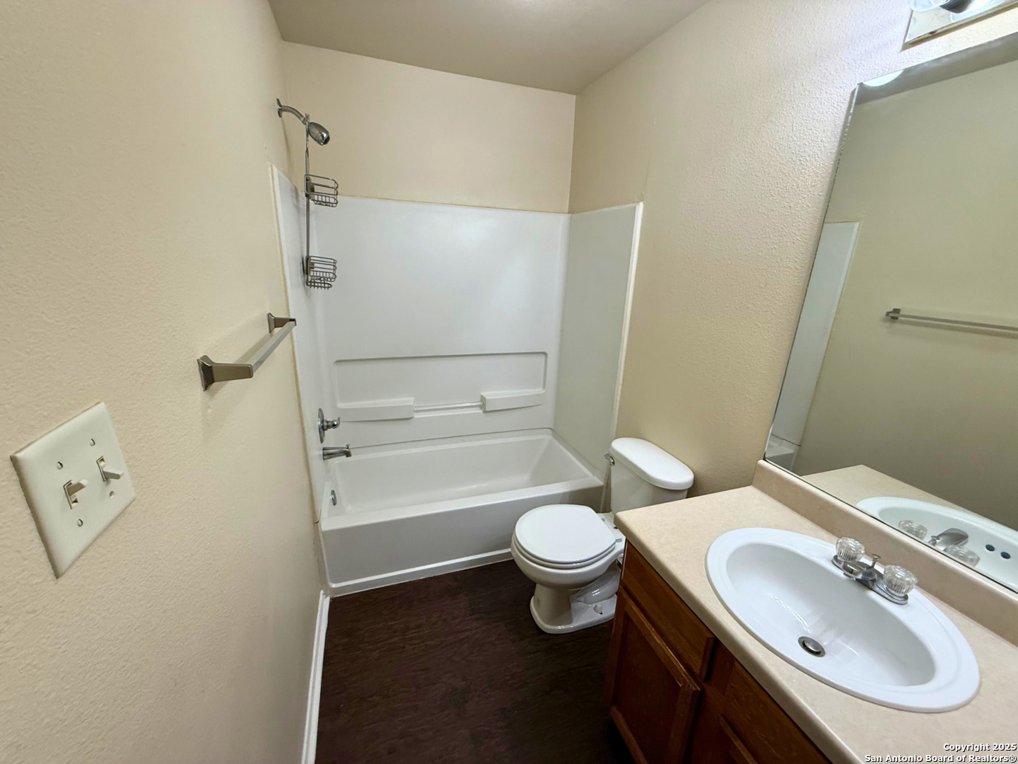 10822 Mathom Landing, Unit 3 Universal City, TX 78148 - Photo 7 of 14 a bathroom with a sink toilet and shower