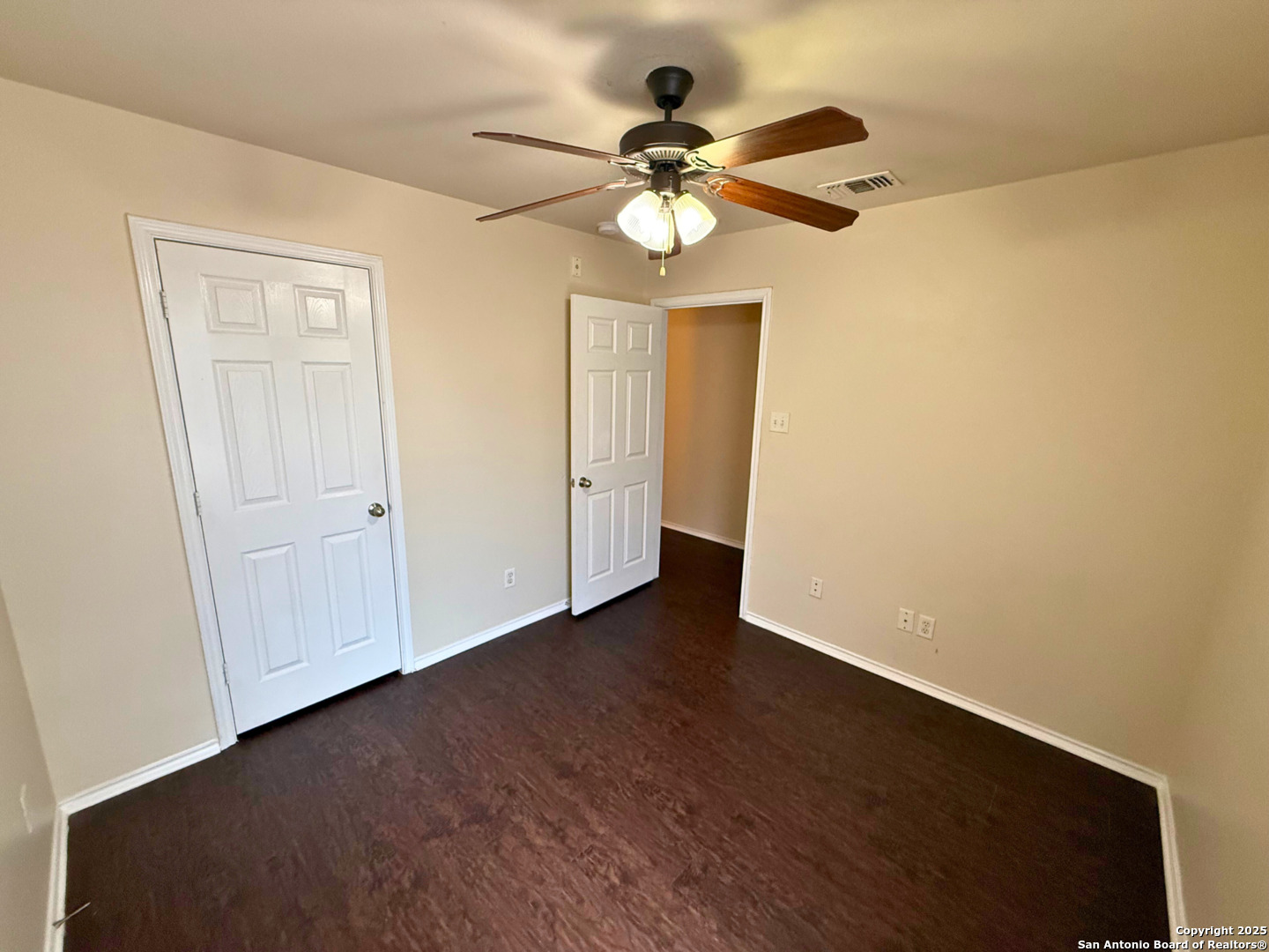 10822 Mathom Landing, Unit 3 Universal City, TX 78148 - Photo 9 of 14 a view of an empty room with wooden floor