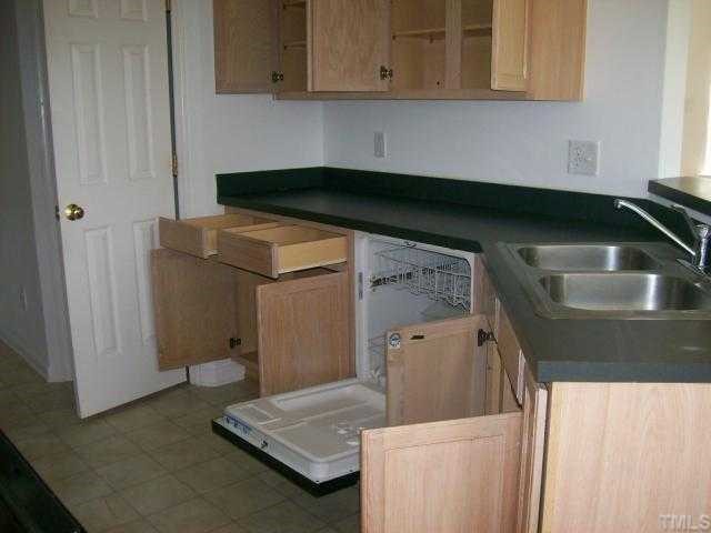 4116 Palafox Court Raleigh, NC 27604 - Photo 4 of 4 a kitchen with a sink and cabinets