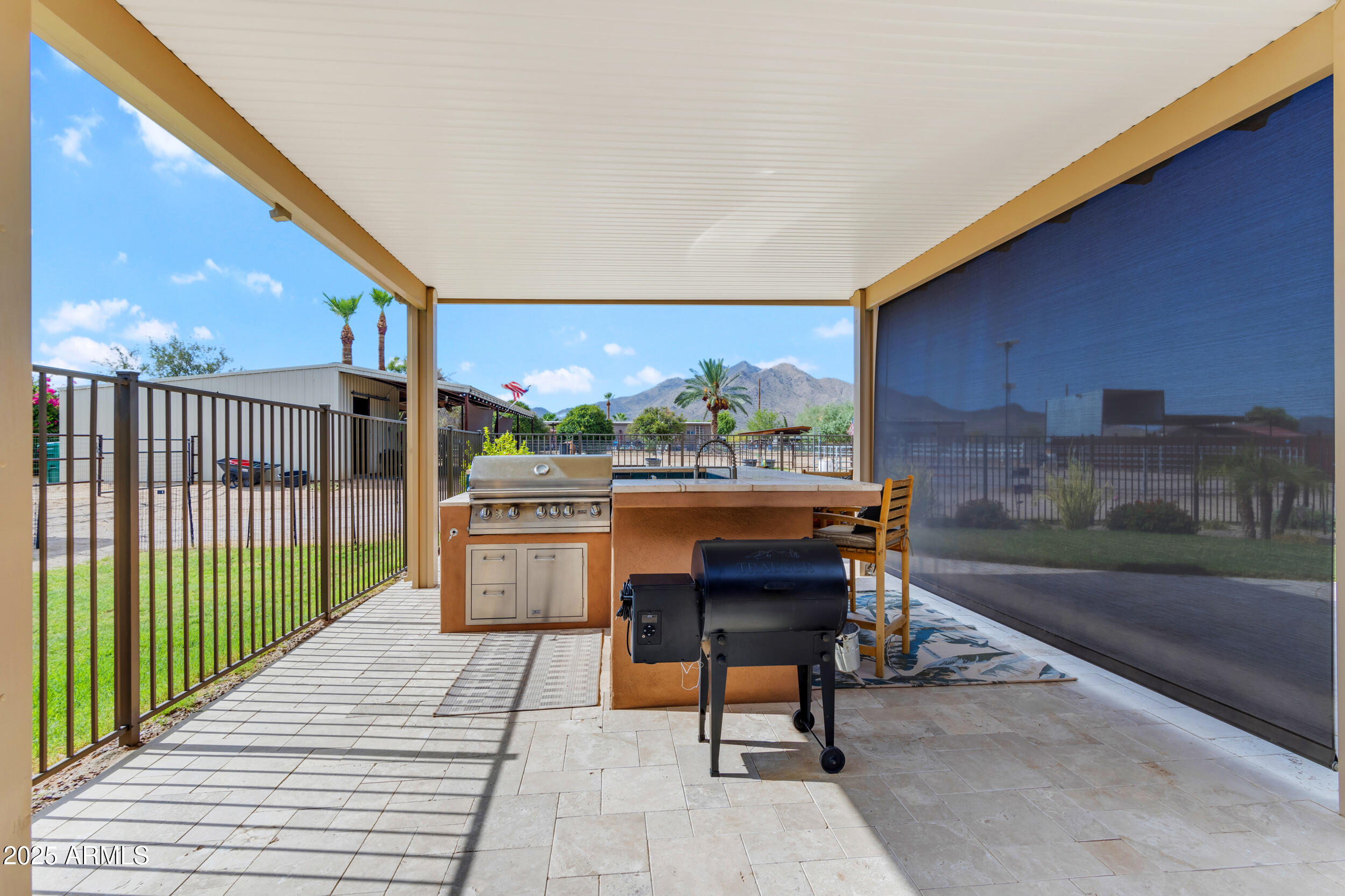 17707 East Stacey Road Queen Creek, AZ 85142 - Photo 63 of 89 a patio with a table and chairs