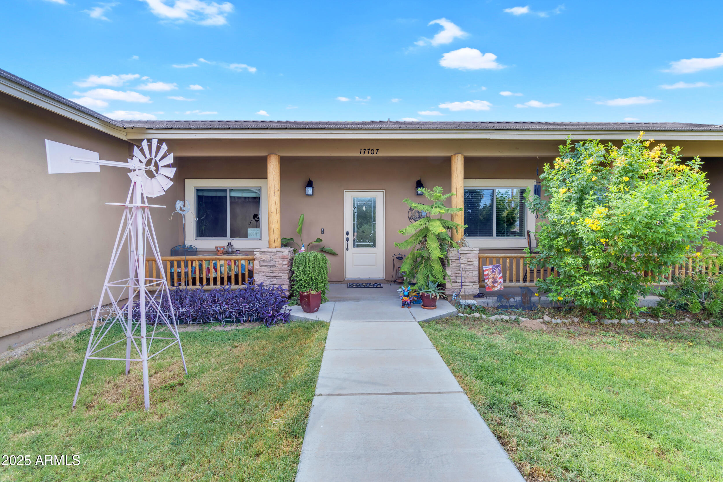 17707 East Stacey Road Queen Creek, AZ 85142 - Photo 80 of 89 a view of a house with a backyard and porch