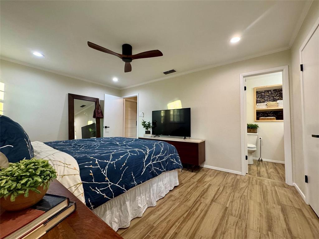 1116 Willow Creek Road Cleburne, TX 76033 - Photo 12 of 25 a bedroom with a bed and a flat screen tv