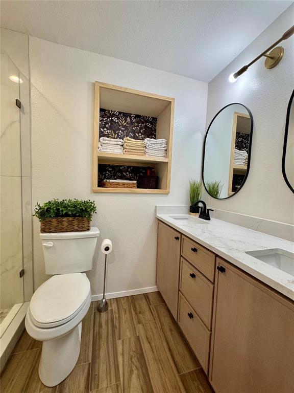 1116 Willow Creek Road Cleburne, TX 76033 - Photo 13 of 25 a bathroom with a toilet a sink and mirror