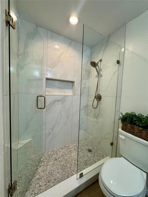 1116 Willow Creek Road Cleburne, TX 76033 - Photo 14 of 25 a bathroom with a toilet and a shower