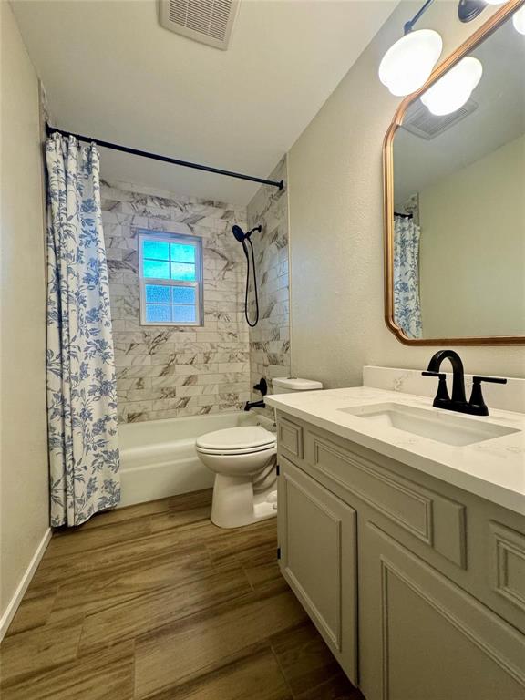 1116 Willow Creek Road Cleburne, TX 76033 - Photo 17 of 25 a bathroom with a sink a toilet and shower