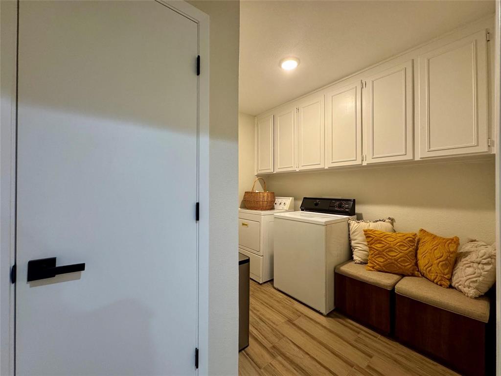 1116 Willow Creek Road Cleburne, TX 76033 - Photo 18 of 25 a living room with furniture and a wooden floor