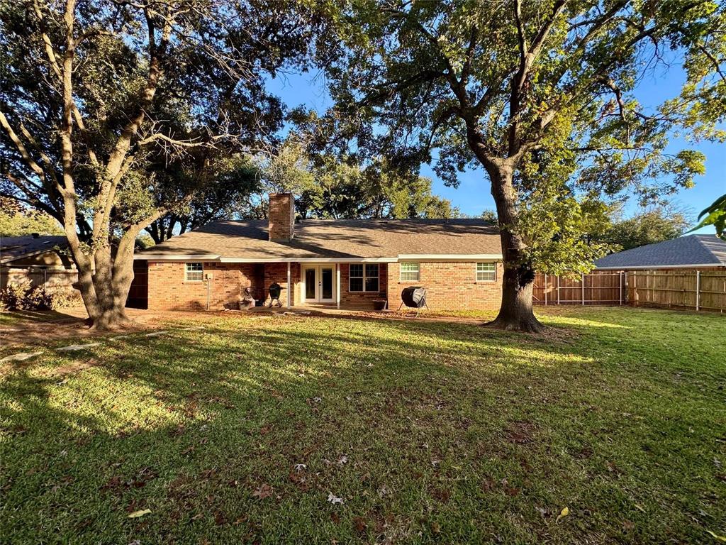 1116 Willow Creek Road Cleburne, TX 76033 - Photo 19 of 25 a front view of a house with a garden