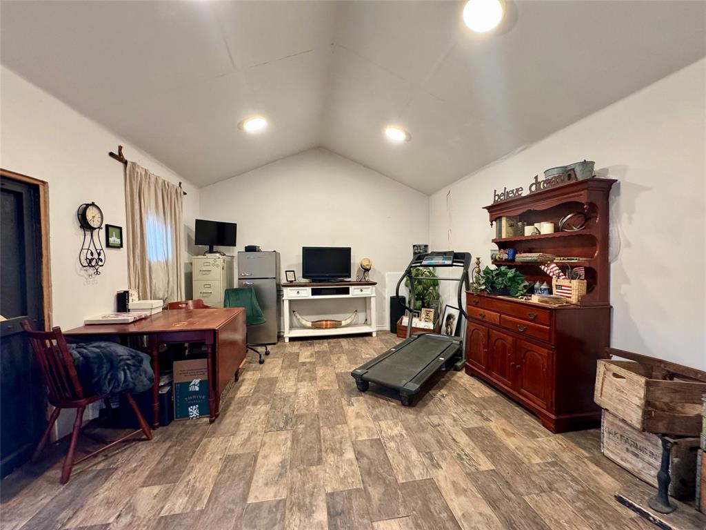1116 Willow Creek Road Cleburne, TX 76033 - Photo 21 of 25 a living room with furniture and flat screen tv