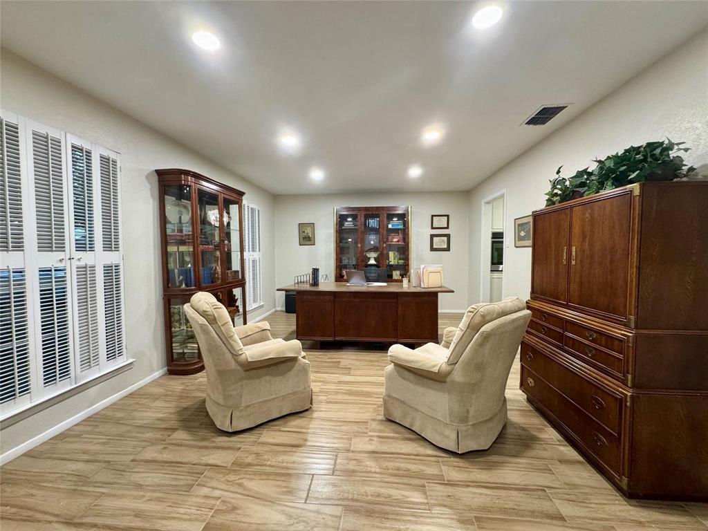 1116 Willow Creek Road Cleburne, TX 76033 - Photo 3 of 25 a living room with furniture and a wooden floor