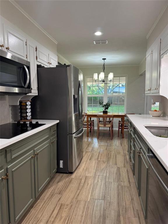 1116 Willow Creek Road Cleburne, TX 76033 - Photo 10 of 25 a kitchen with kitchen island granite countertop a sink appliances and cabinets