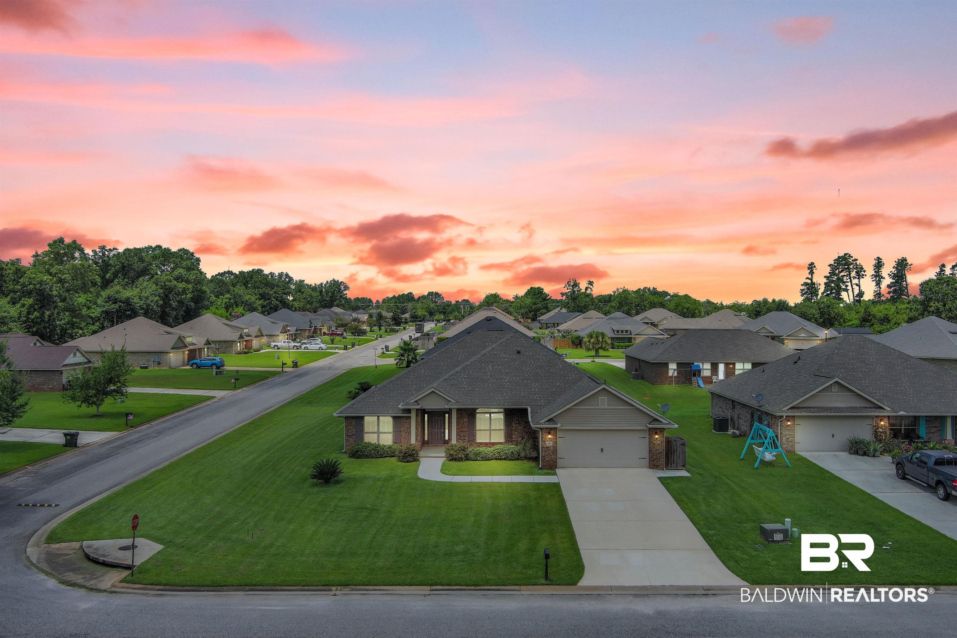 13155 Wishbone Court Foley, AL 36535 - Photo 1 of 39 View of front of house featuring a garage and a lawn