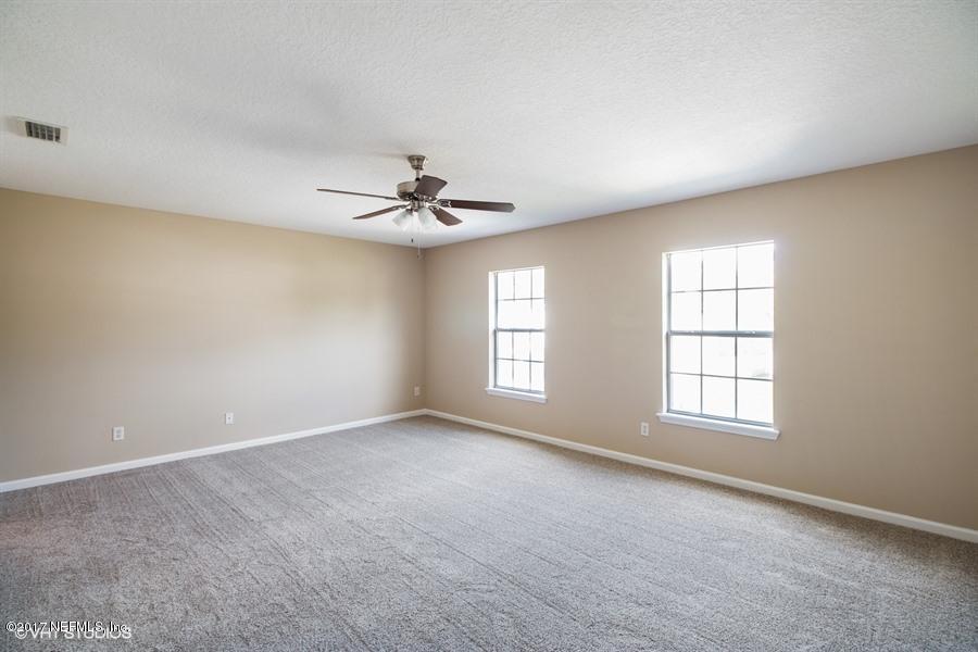 7225 Rampart Ridge Circle West Jacksonville, FL 32244 - Photo 10 of 15 a view of an empty room with windows