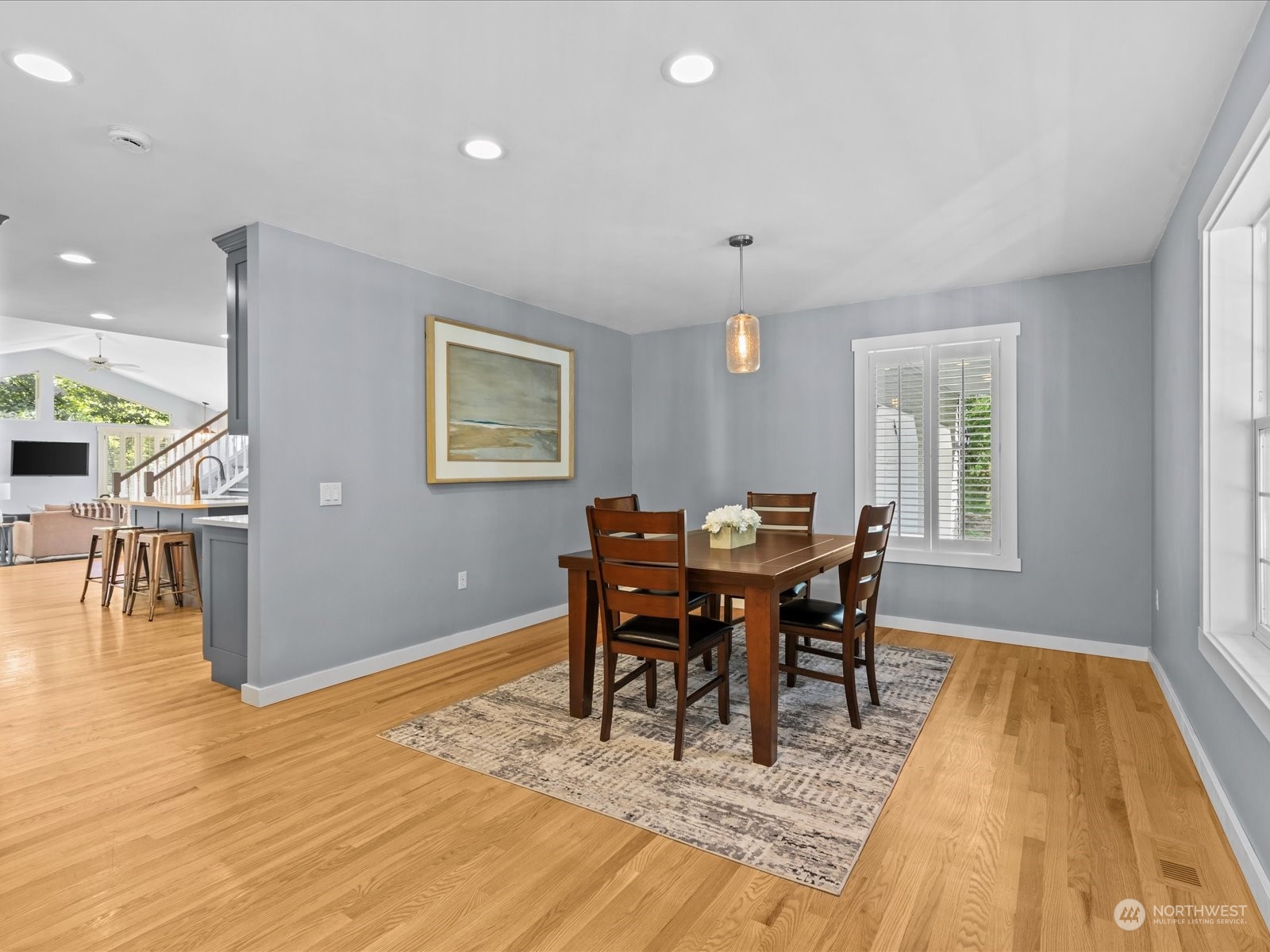 19911 Welch Road Snohomish, WA 98296 - Photo 12 of 40 a view of a dining room with furniture and wooden floor