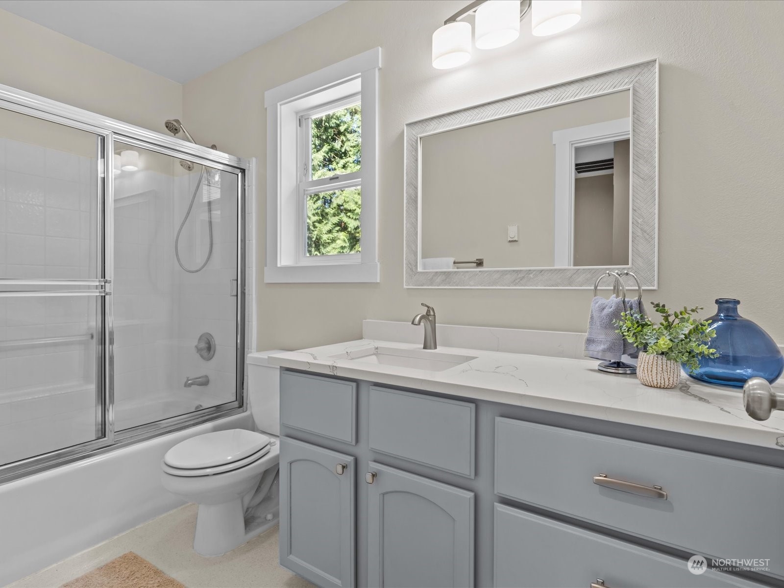19911 Welch Road Snohomish, WA 98296 - Photo 24 of 40 a bathroom with a granite countertop sink a toilet and shower