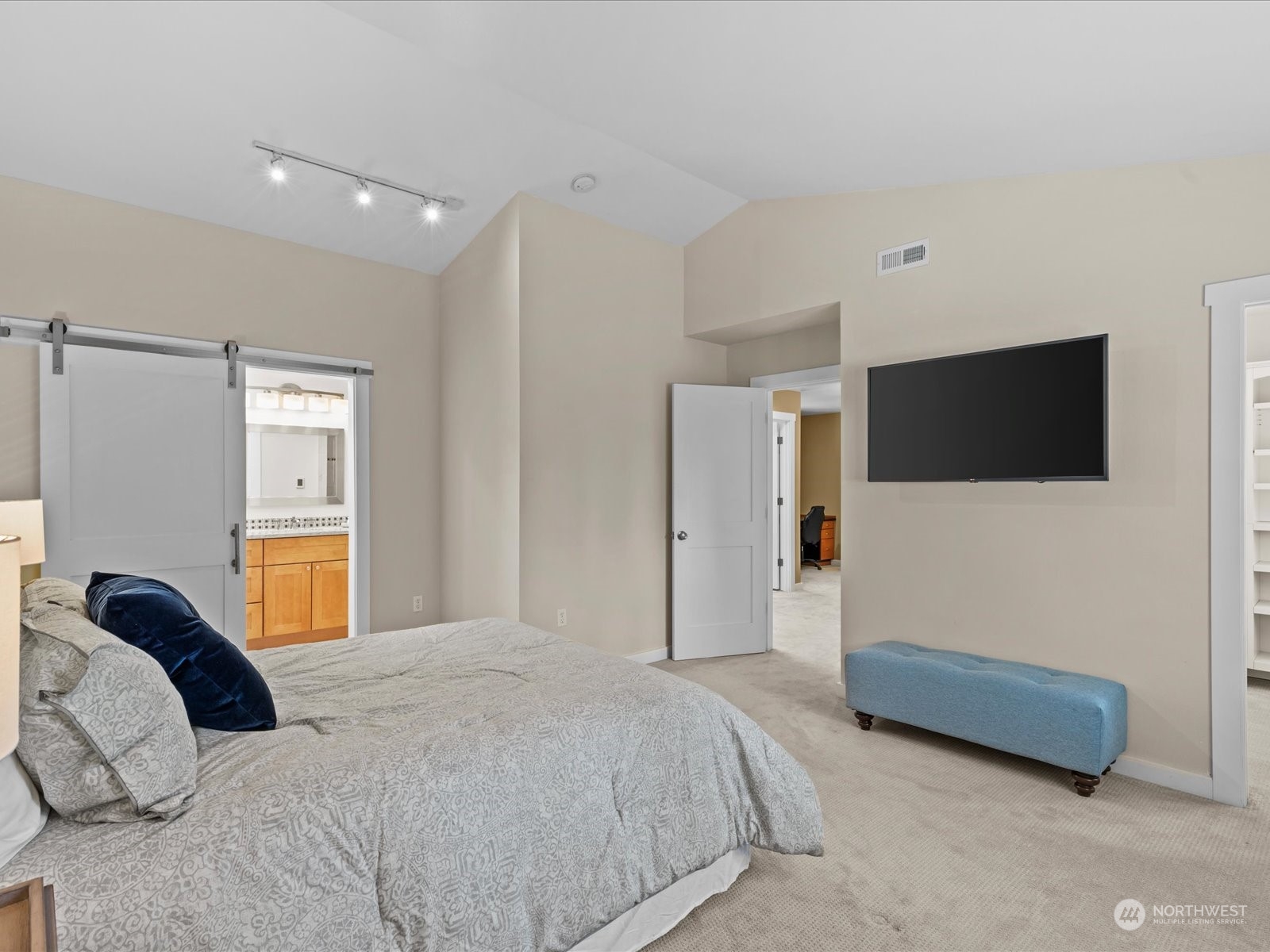 19911 Welch Road Snohomish, WA 98296 - Photo 27 of 40 a bedroom with a bed and a flat screen tv