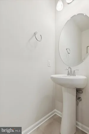 a bathroom with a sink a mirror and shower