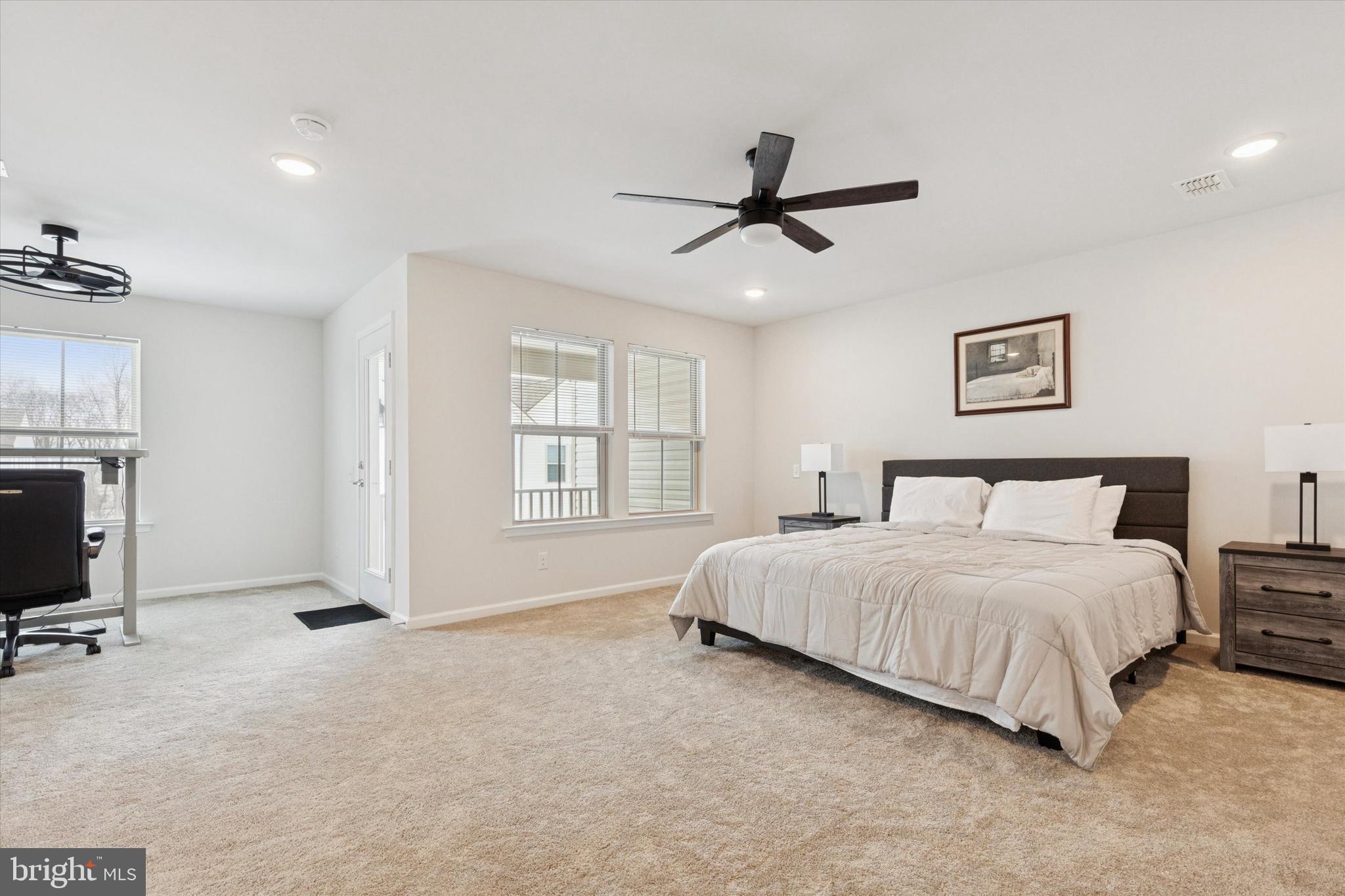 619 Liberty Ridge Road Horsham, PA 19044 - Photo 13 of 30 a spacious bedroom with a bed a window and a flat screen television