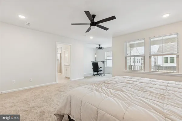 a bed room with a bed and a window