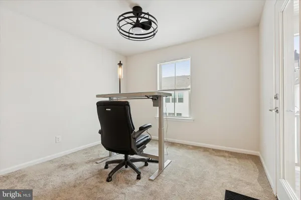 a view of a workspace with furniture