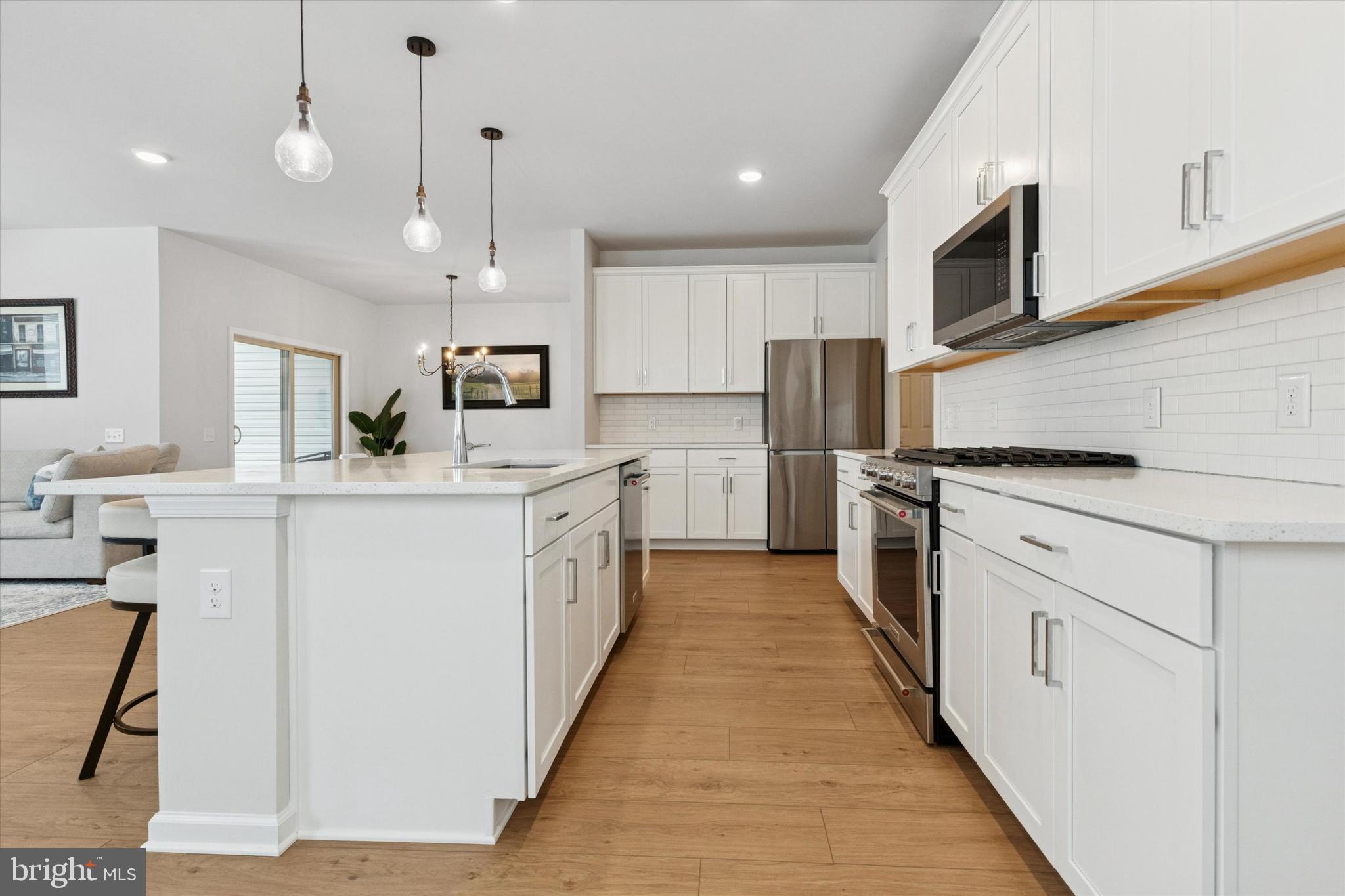 619 Liberty Ridge Road Horsham, PA 19044 - Photo 3 of 30 a kitchen with white cabinets and stainless steel appliances