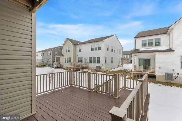 a view of a house with wooden deck