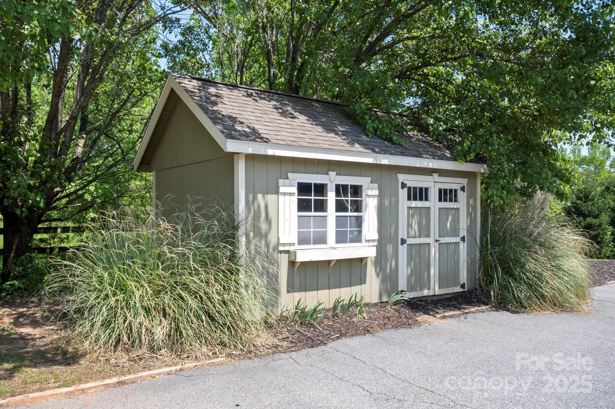 2409 Golf Course Road, Unit 14 Columbus, NC 28722 - Photo 11 of 25 a view of front of house with a yard