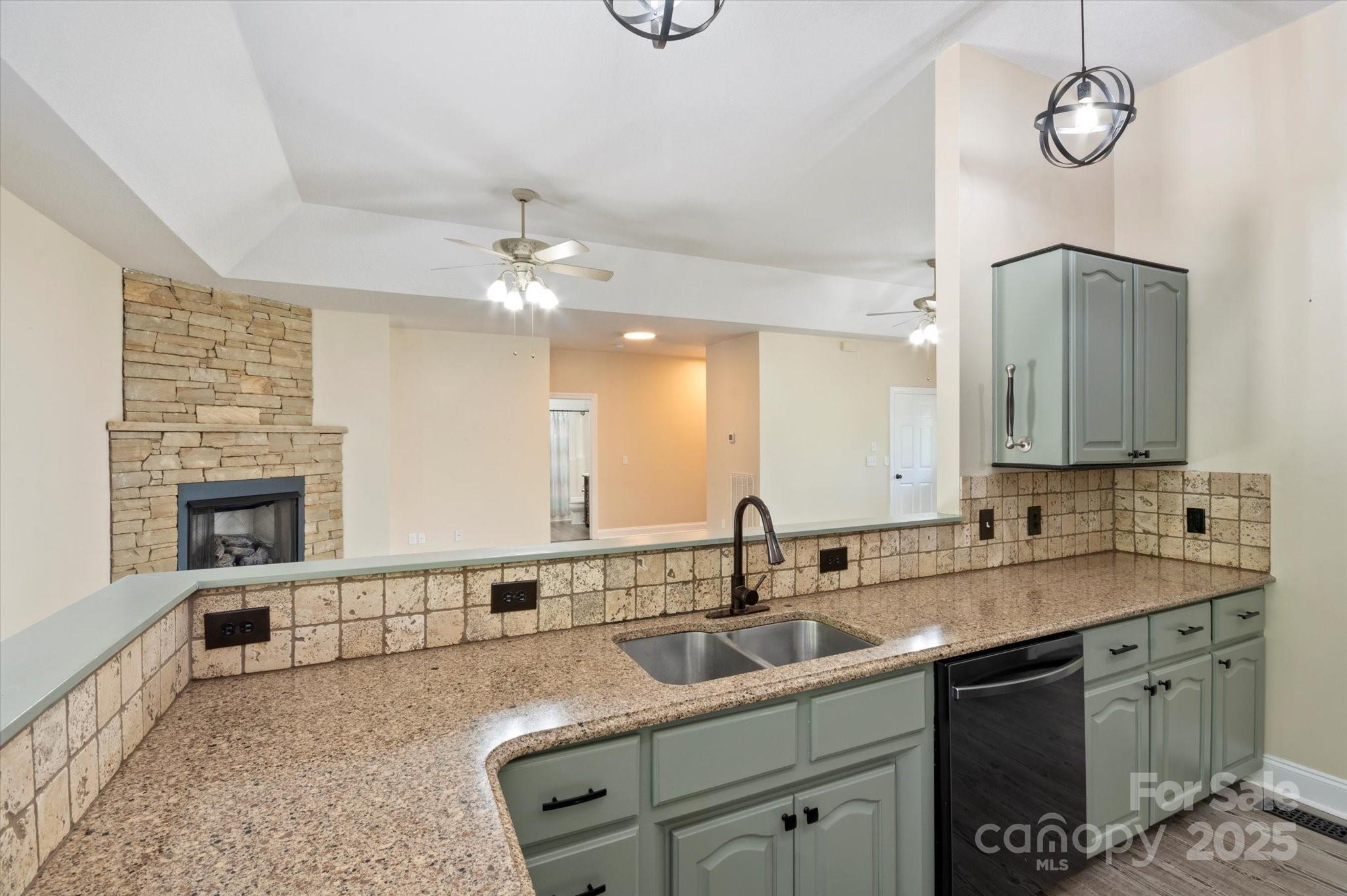 2409 Golf Course Road, Unit 14 Columbus, NC 28722 - Photo 15 of 25 a kitchen with a sink cabinets and window