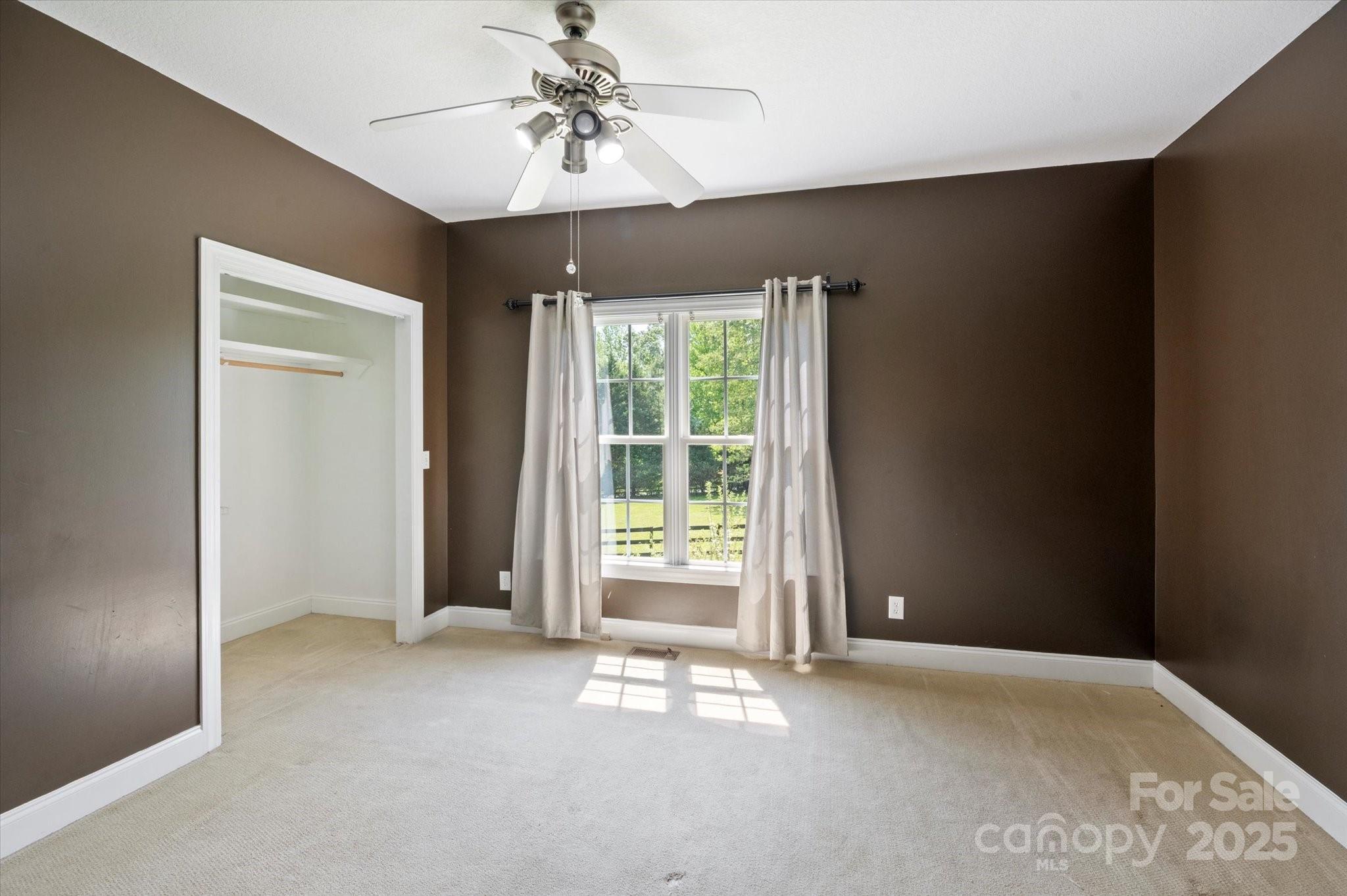 2409 Golf Course Road, Unit 14 Columbus, NC 28722 - Photo 18 of 25 a view of an empty room with a window
