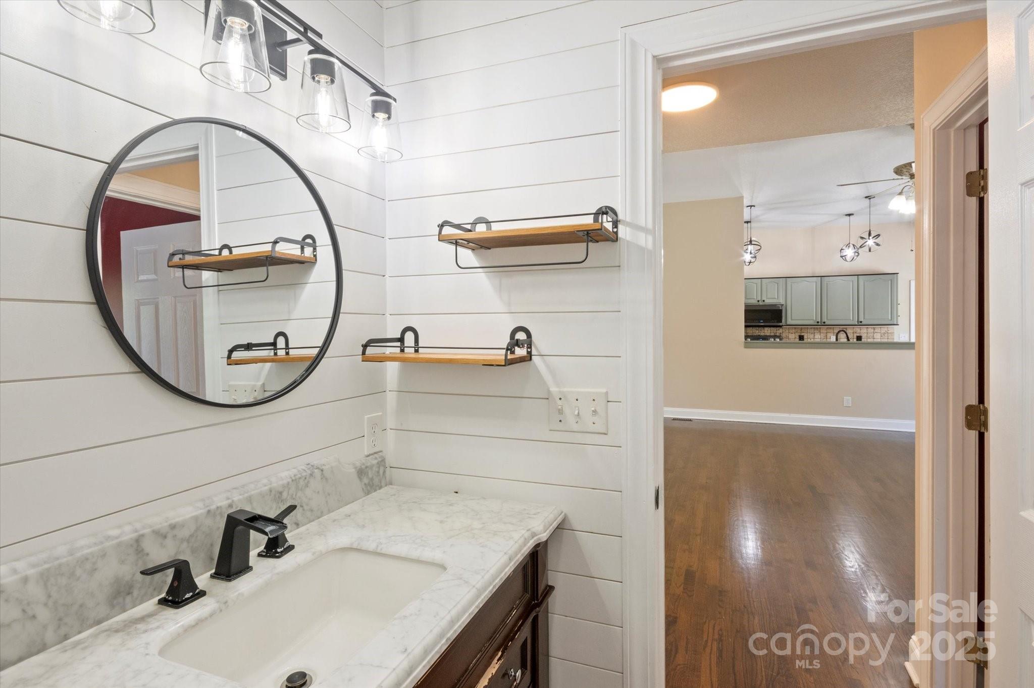 2409 Golf Course Road, Unit 14 Columbus, NC 28722 - Photo 19 of 25 a bathroom with a sink and a mirror