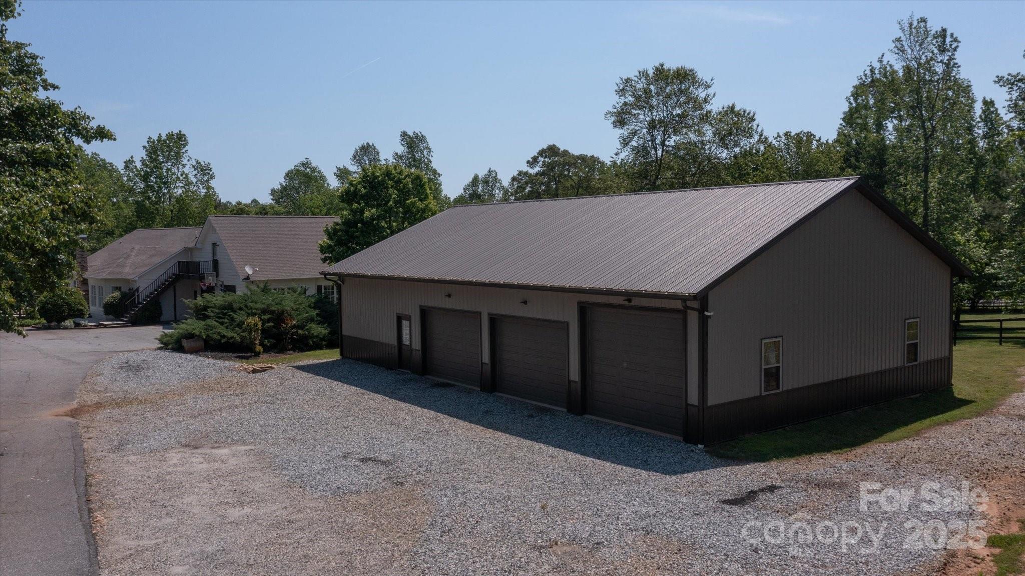 2409 Golf Course Road, Unit 14 Columbus, NC 28722 - Photo 2 of 25 a house with trees in the background