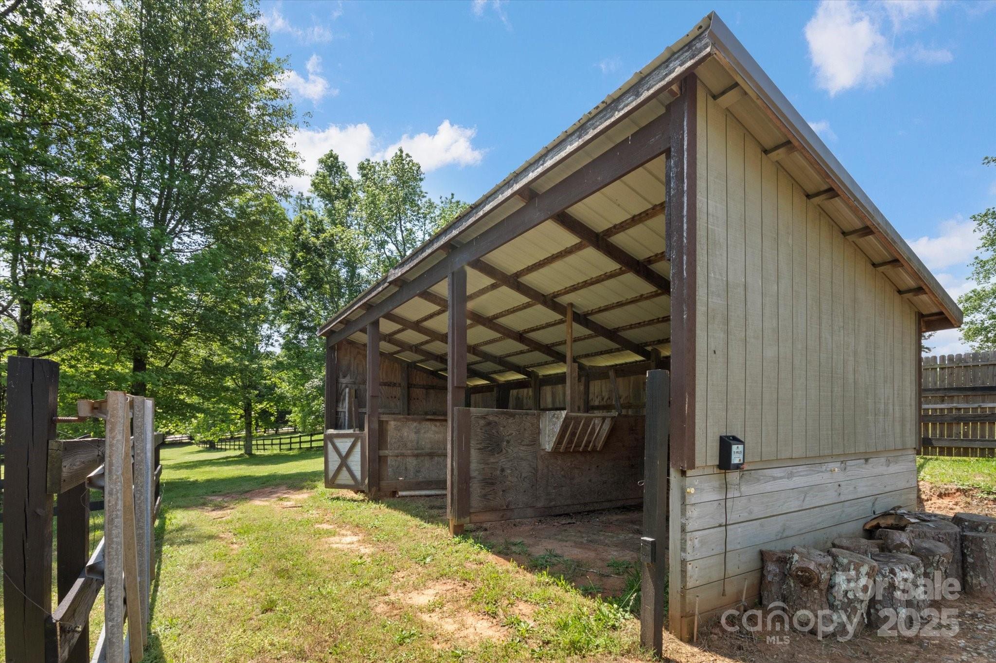 2409 Golf Course Road, Unit 14 Columbus, NC 28722 - Photo 10 of 25 a backyard of a house with lots of green space