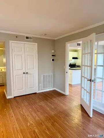 an empty room with a mirror